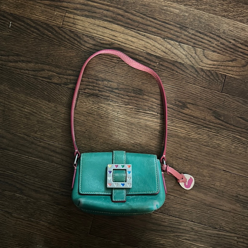 Dooney & Bourke turquoise mini square flap purse. Magnet closure.